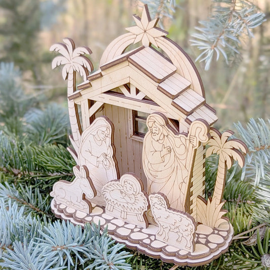 Wooden nativity scene ornament on a Christmas tree