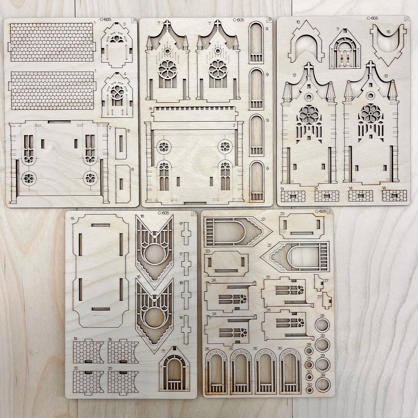 teh Gotic Cathedral model parts on a wooden surface