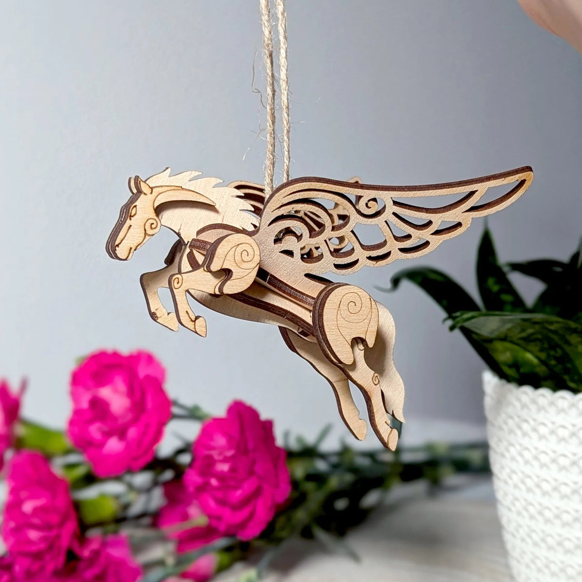 Handmade plywood fantasy horse miniature with spread wings, crafted as a decorative 3D model kit.