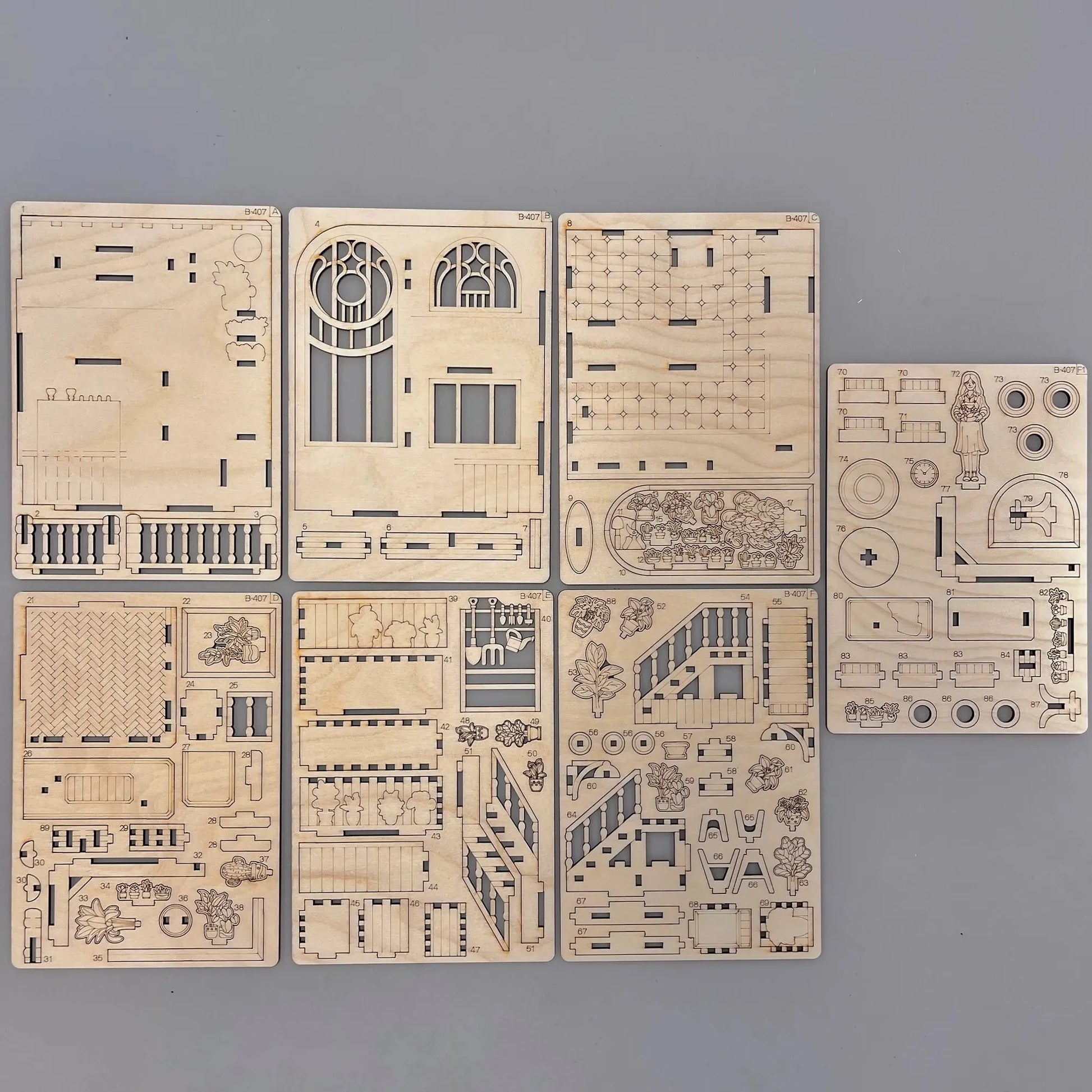 The book-nook model parts on a wooden surface