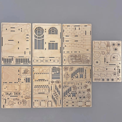 The book-nook model parts on a wooden surface