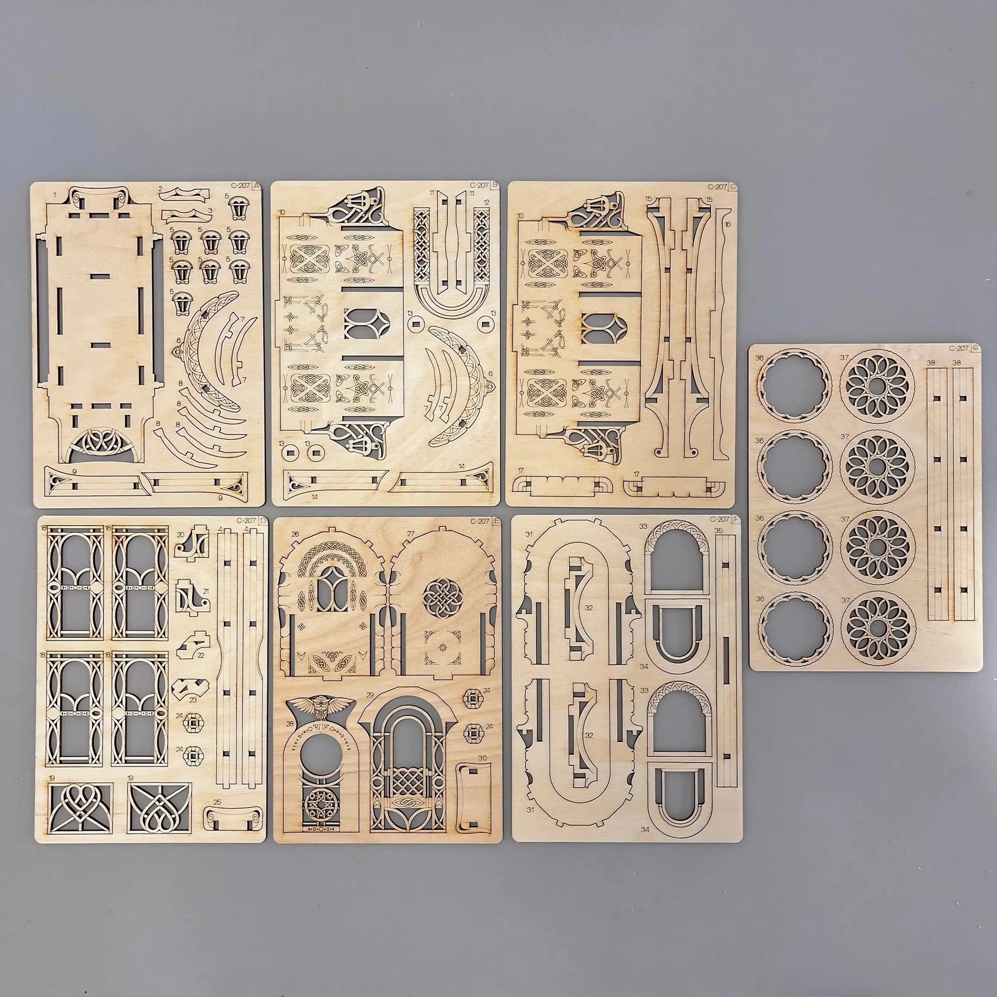 The caravan wagon model parts on a wooden surface