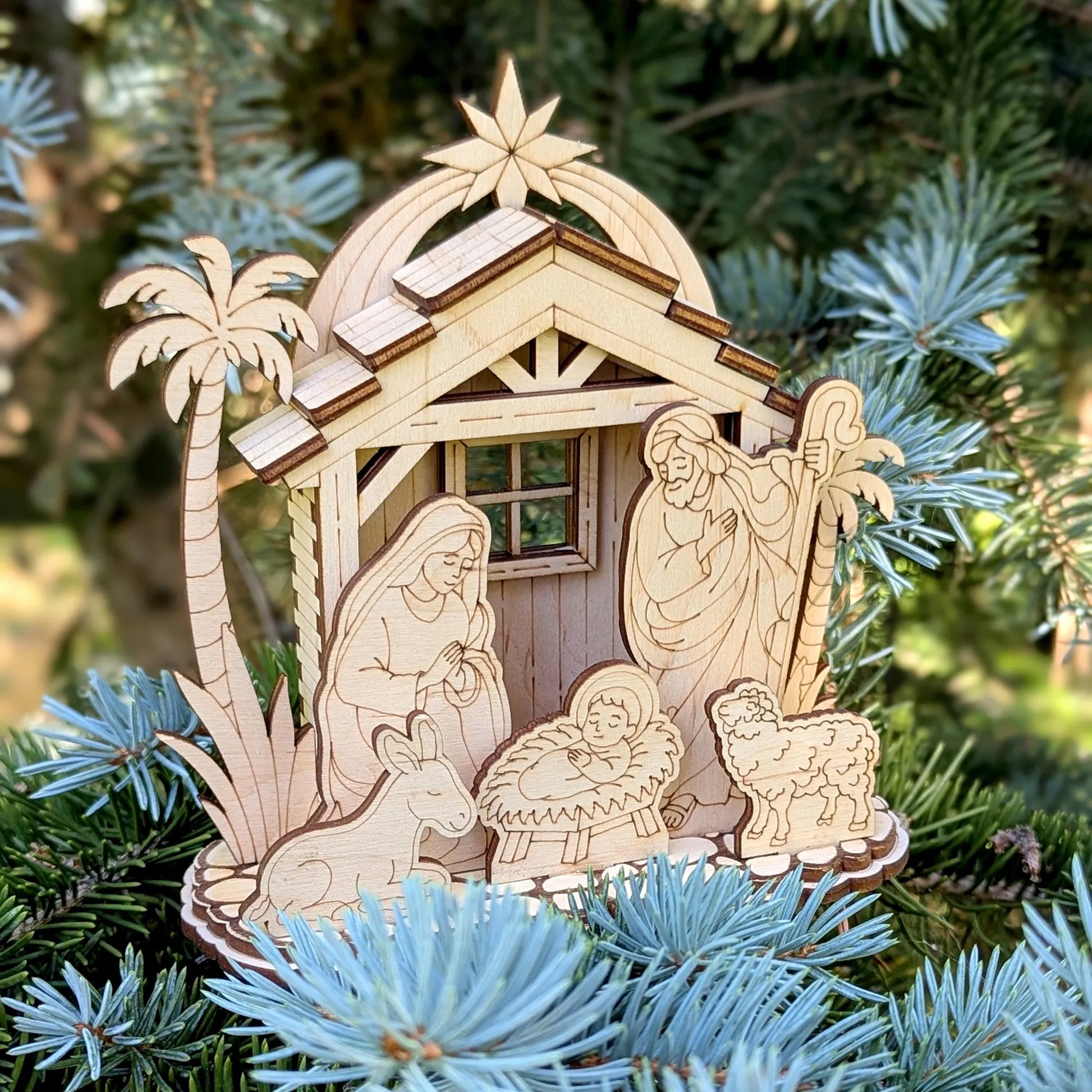 Wooden nativity scene ornament on a Christmas tree