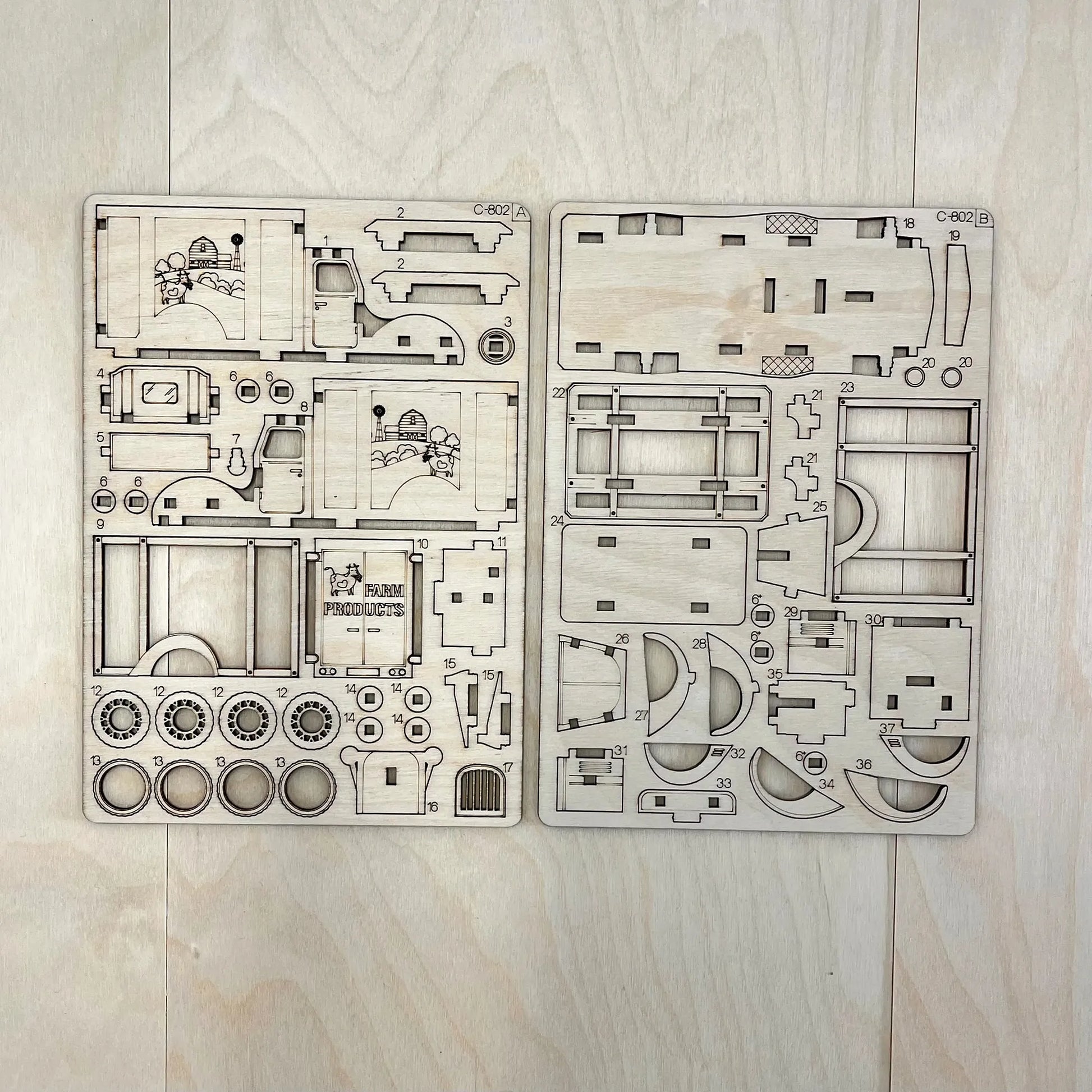 The farm truck model parts on a wooden surface