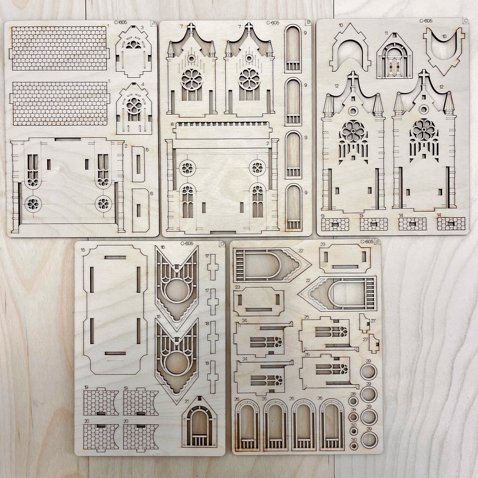 teh Gotic Cathedral model parts on a wooden surface