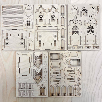 teh Gotic Cathedral model parts on a wooden surface