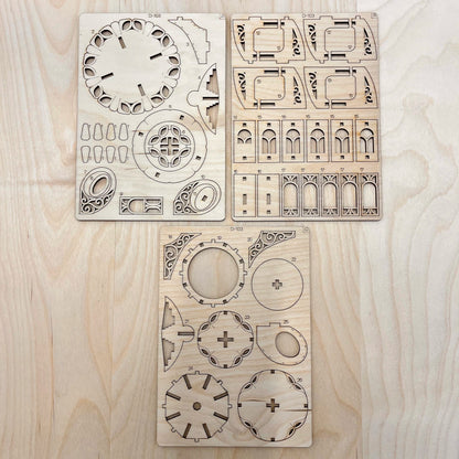 Kettle house model parts on a wooden surface