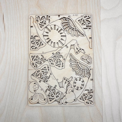 The little angel model parts on a wooden surface