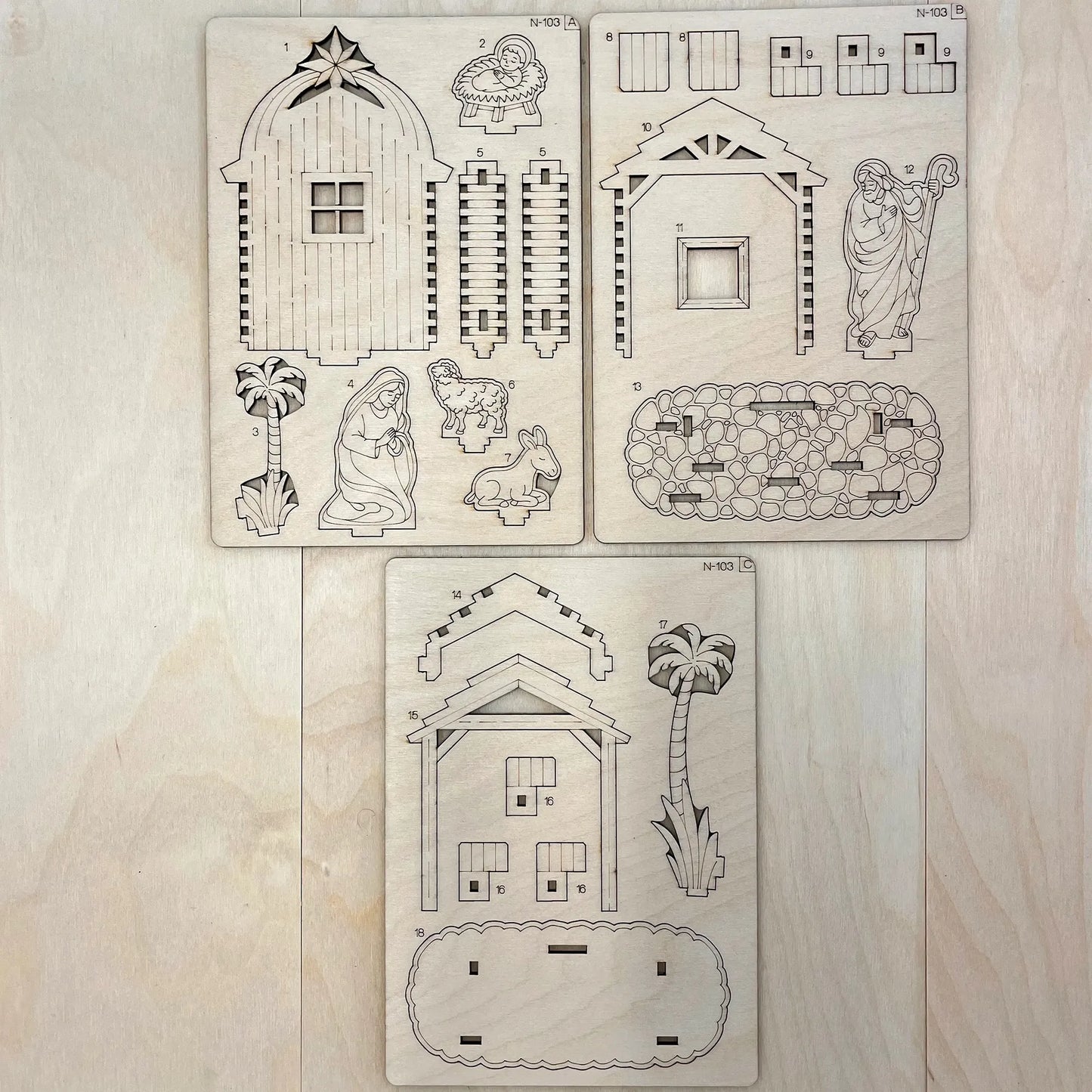 Set of Christmas nativity scene stencils on a wooden surface
