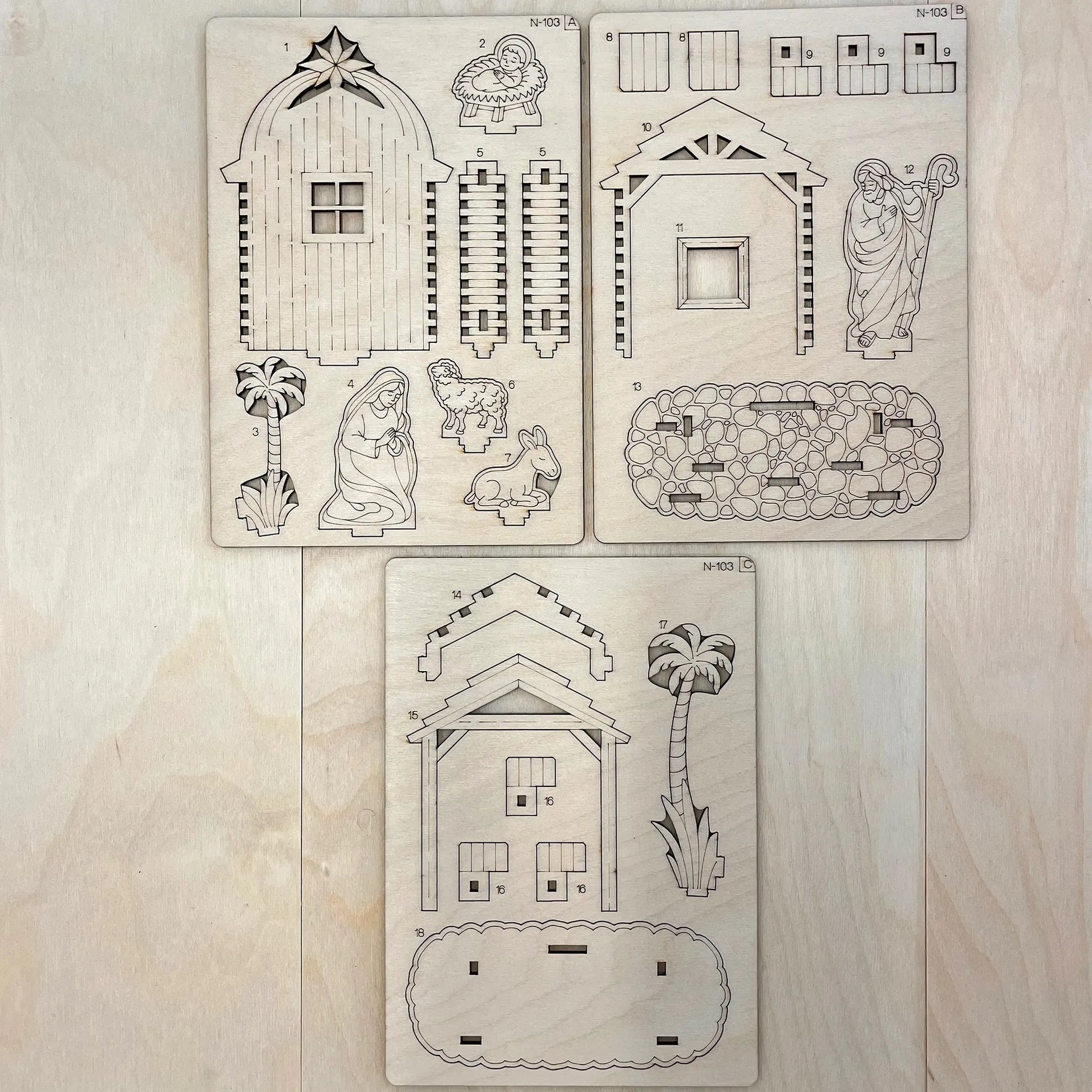 Set of Christmas nativity scene stencils on a wooden surface