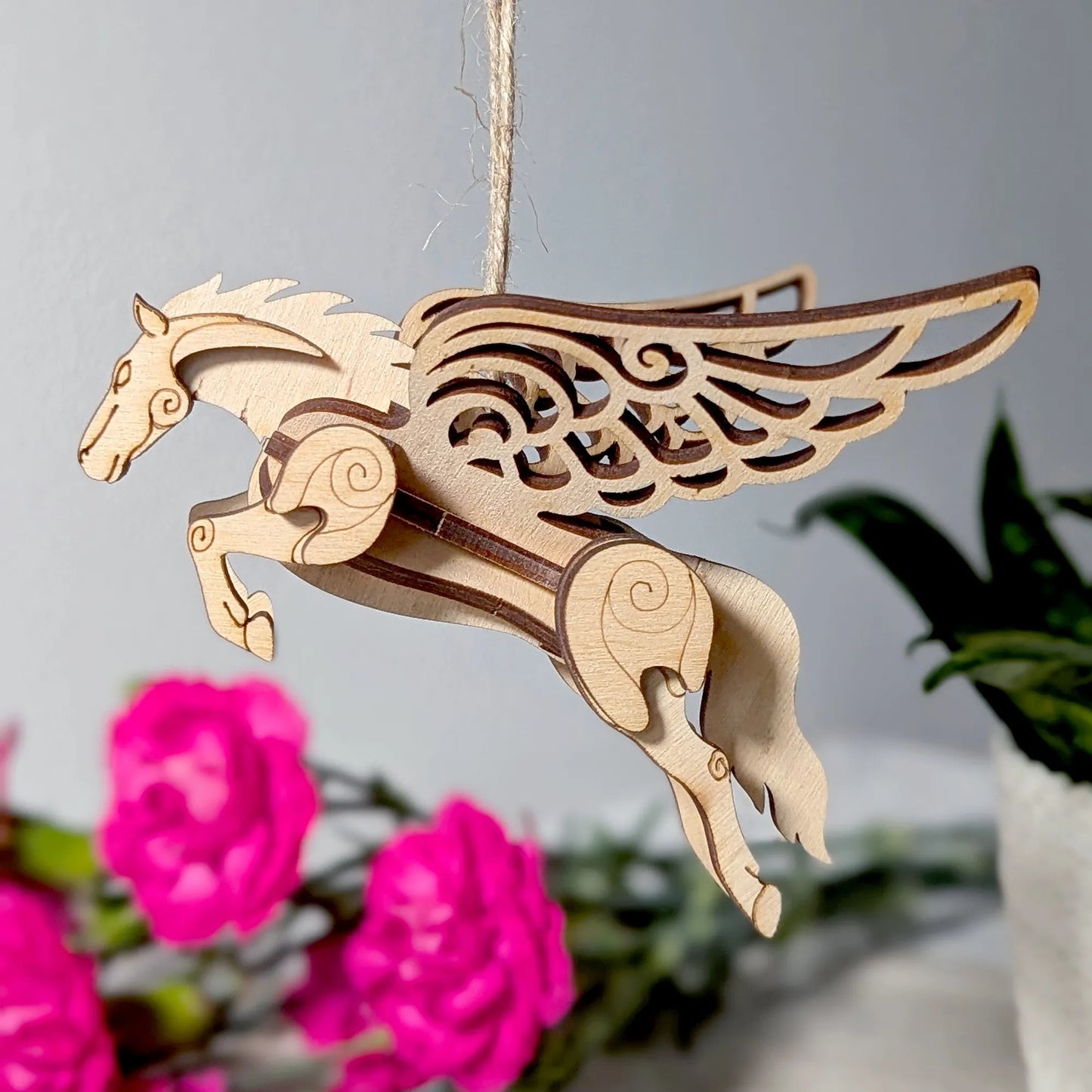 Pegasus-inspired 3D wooden horse miniature with detailed wings and fantasy-style design.