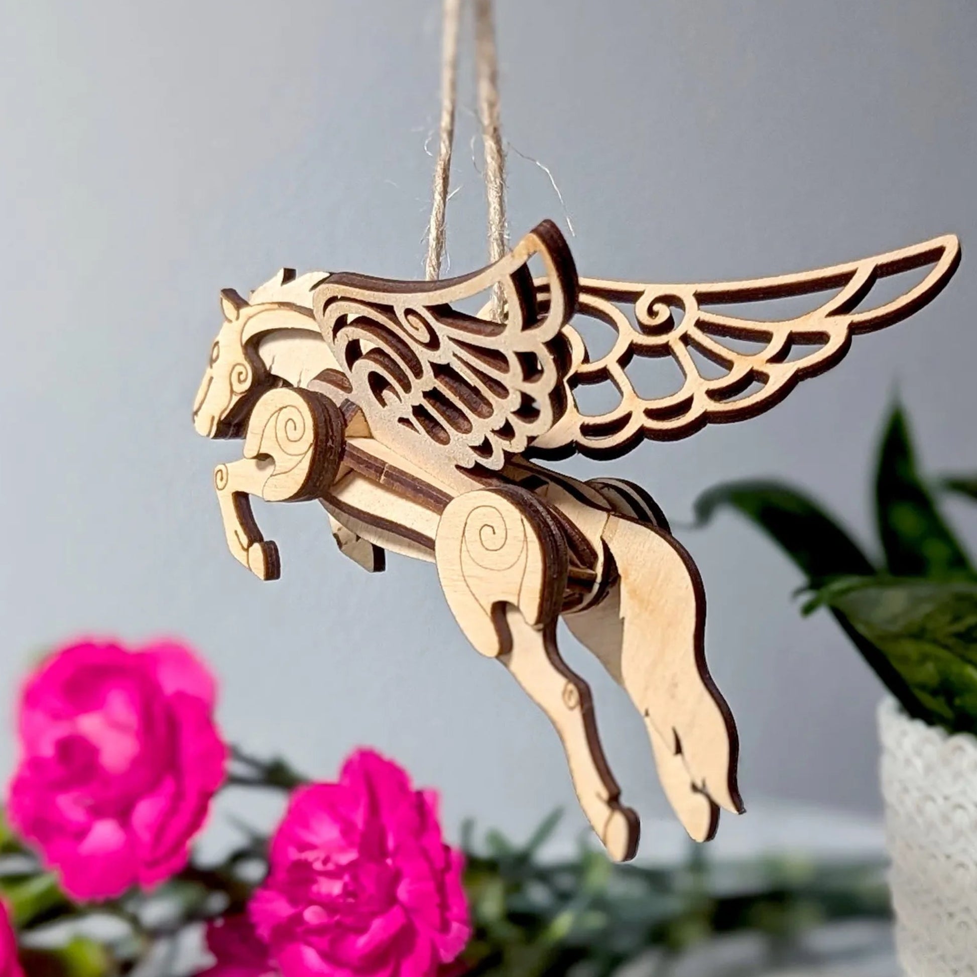 DIY wooden Pegasus model kit featuring intricate engraved details and elegant mythical horse styling.