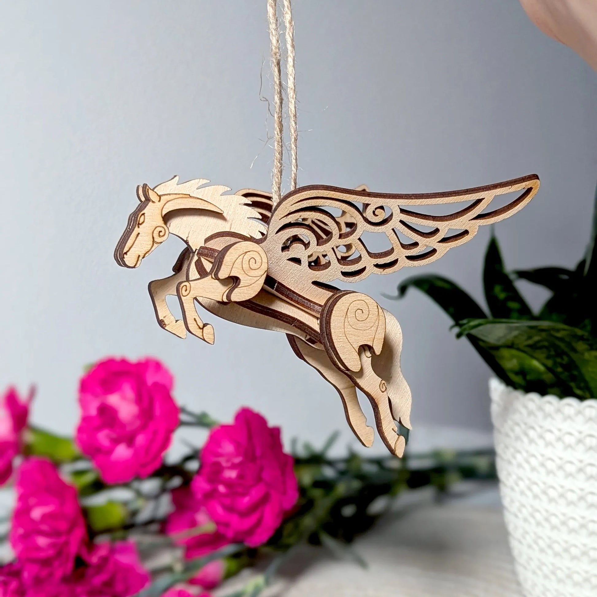 Handmade plywood fantasy horse miniature with spread wings, crafted as a decorative 3D model kit.