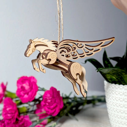 Handmade plywood fantasy horse miniature with spread wings, crafted as a decorative 3D model kit.