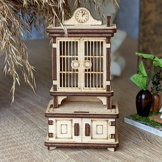 Miniature wooden sideboard model kit with detailed shelves and decorative cabinet doors for dollhouse interiors.