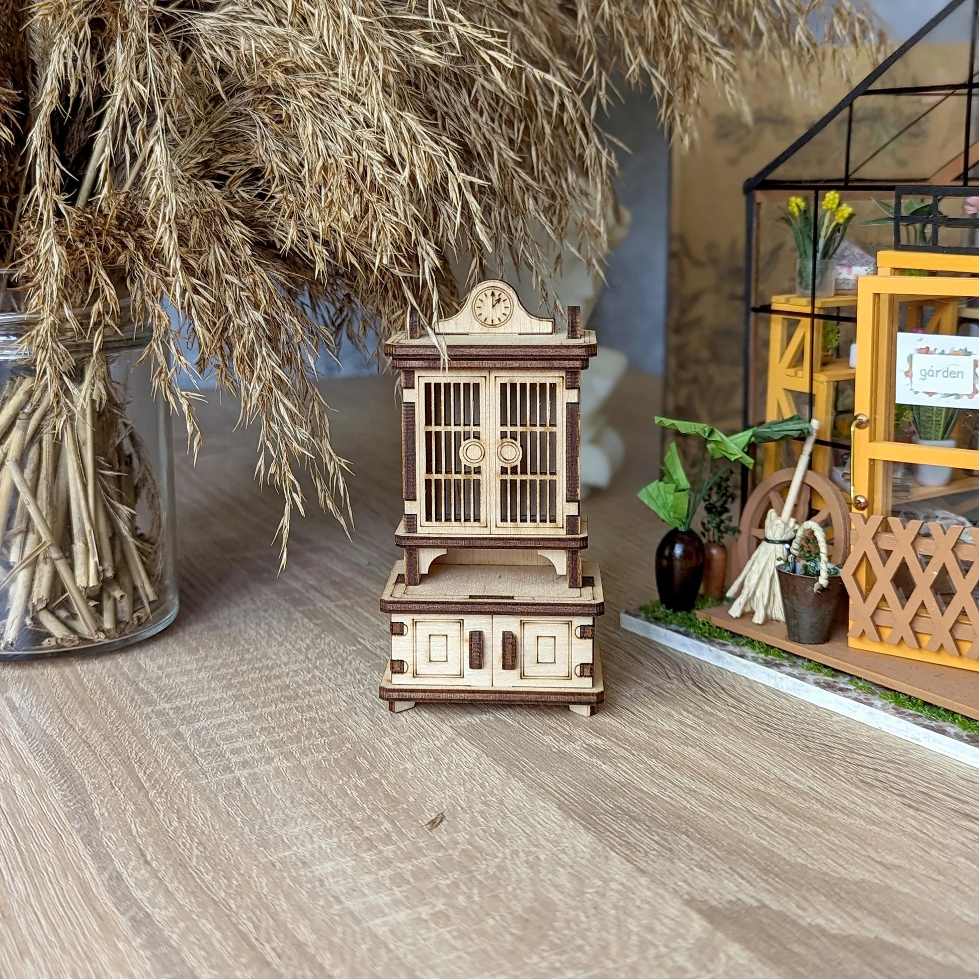 Detailed DIY wooden sideboard kit for dollhouse collectors, with intricate craftsmanship and classic furniture styling.