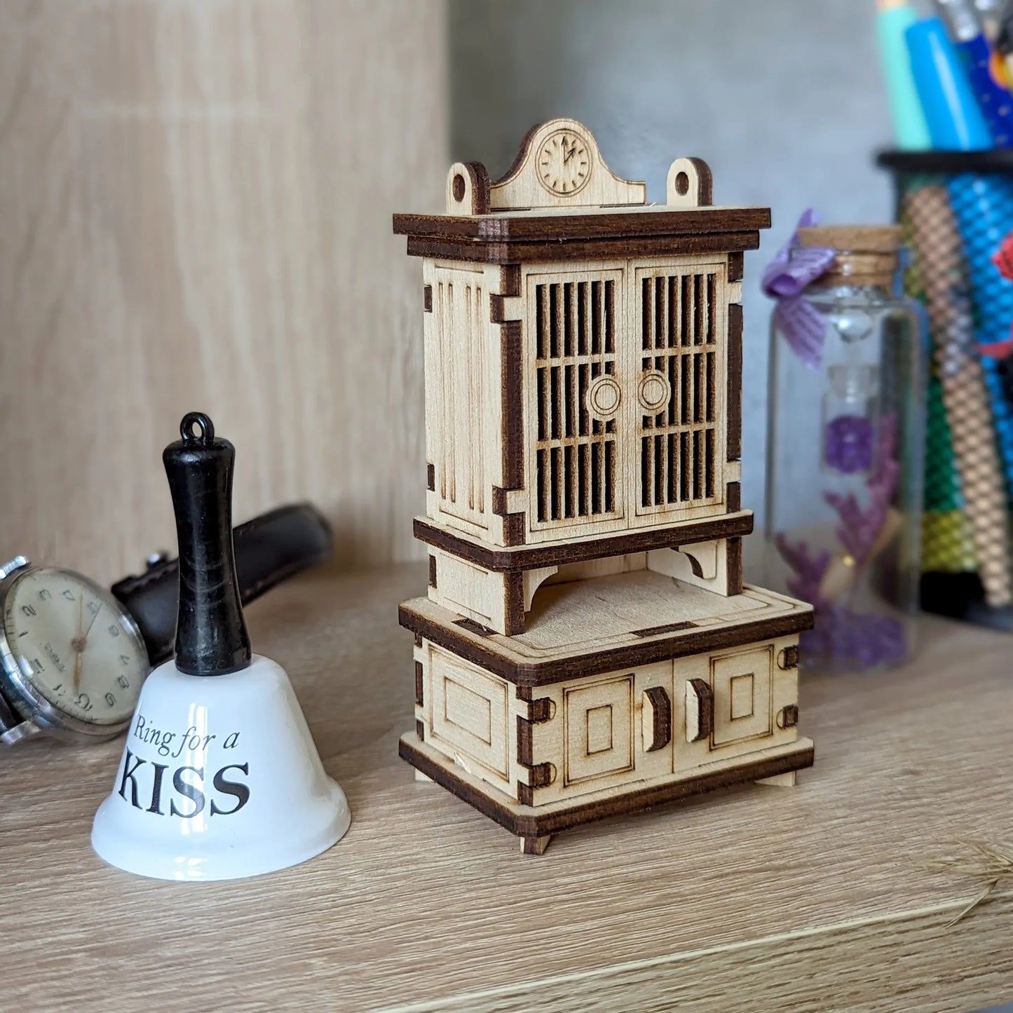 Small wooden sideboard miniature for dollhouses, featuring realistic drawers, storage compartments, and carved accents.