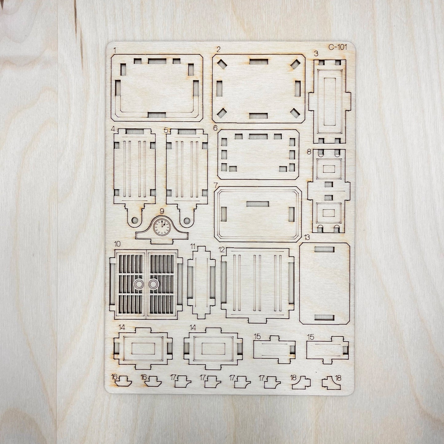 Wooden laser-cut puzzle on a light wooden surface