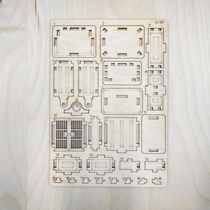 Wooden laser-cut puzzle on a light wooden surface