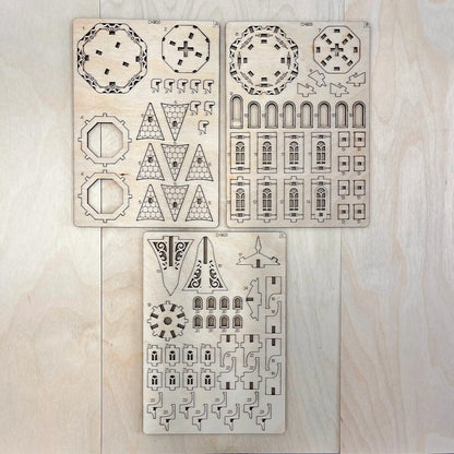 The tower model parts on a wooden surface