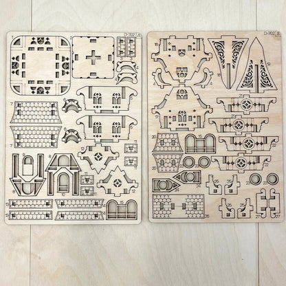 The house model parts on a wooden surface
