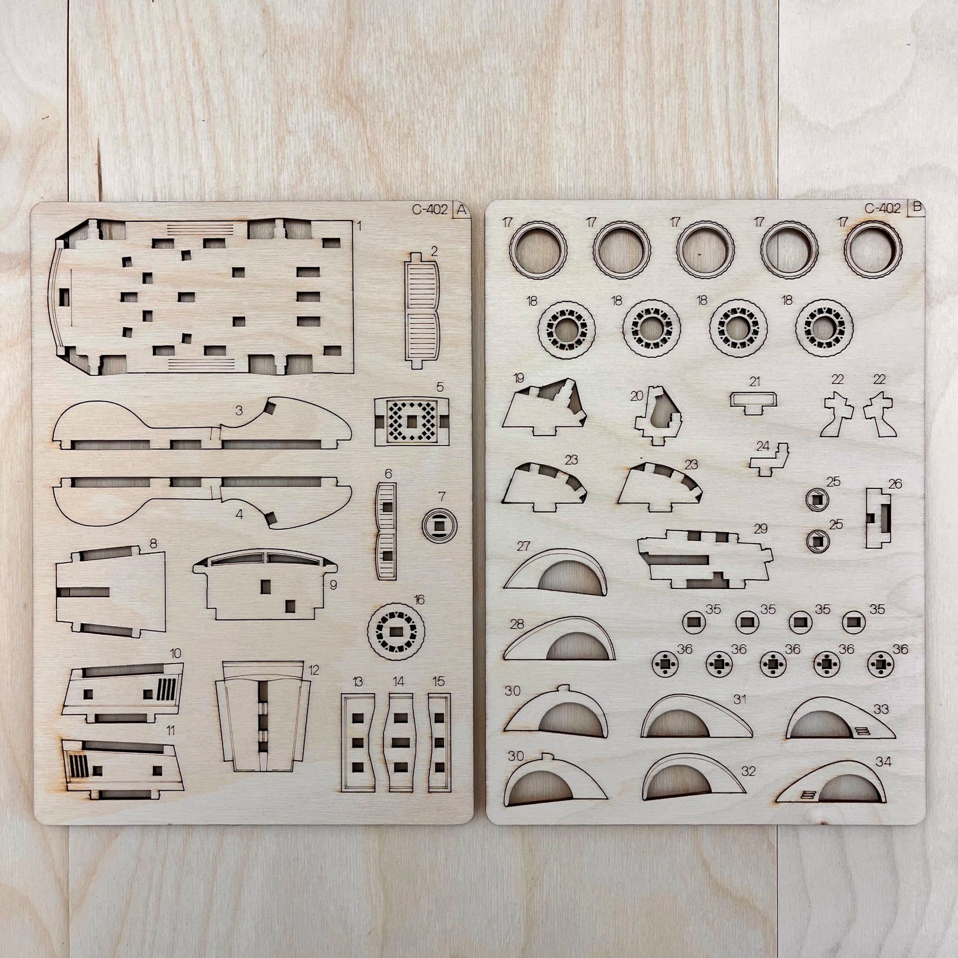 The sportcar model parts on a wooden surface