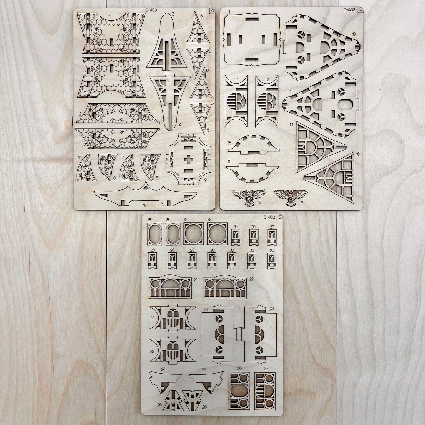 The Whimsy Cottage model parts on a wooden surface