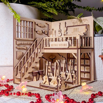 Wooden model of a music store with guitars and shelves, surrounded by decorative elements.