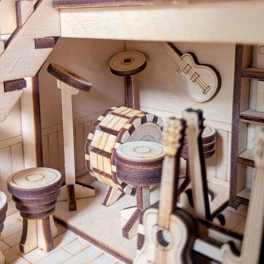 Wooden model of a music store interior.