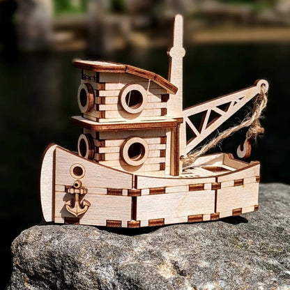 Wooden toy boat on a rock with a natural background