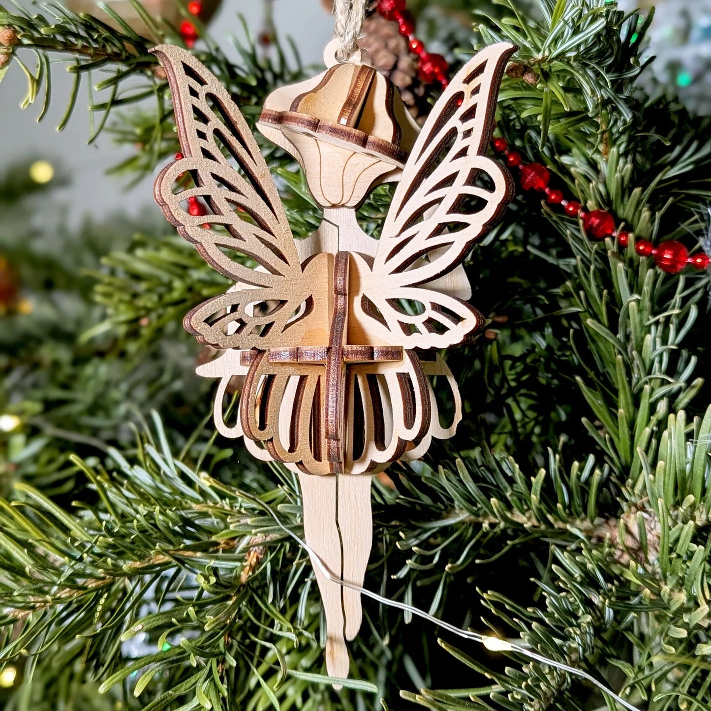 Wooden fairy ornament on a Christmas tree