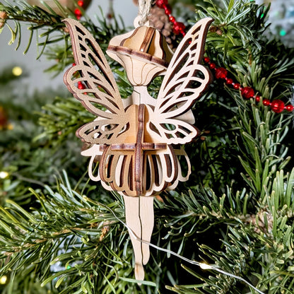 Wooden fairy ornament on a Christmas tree