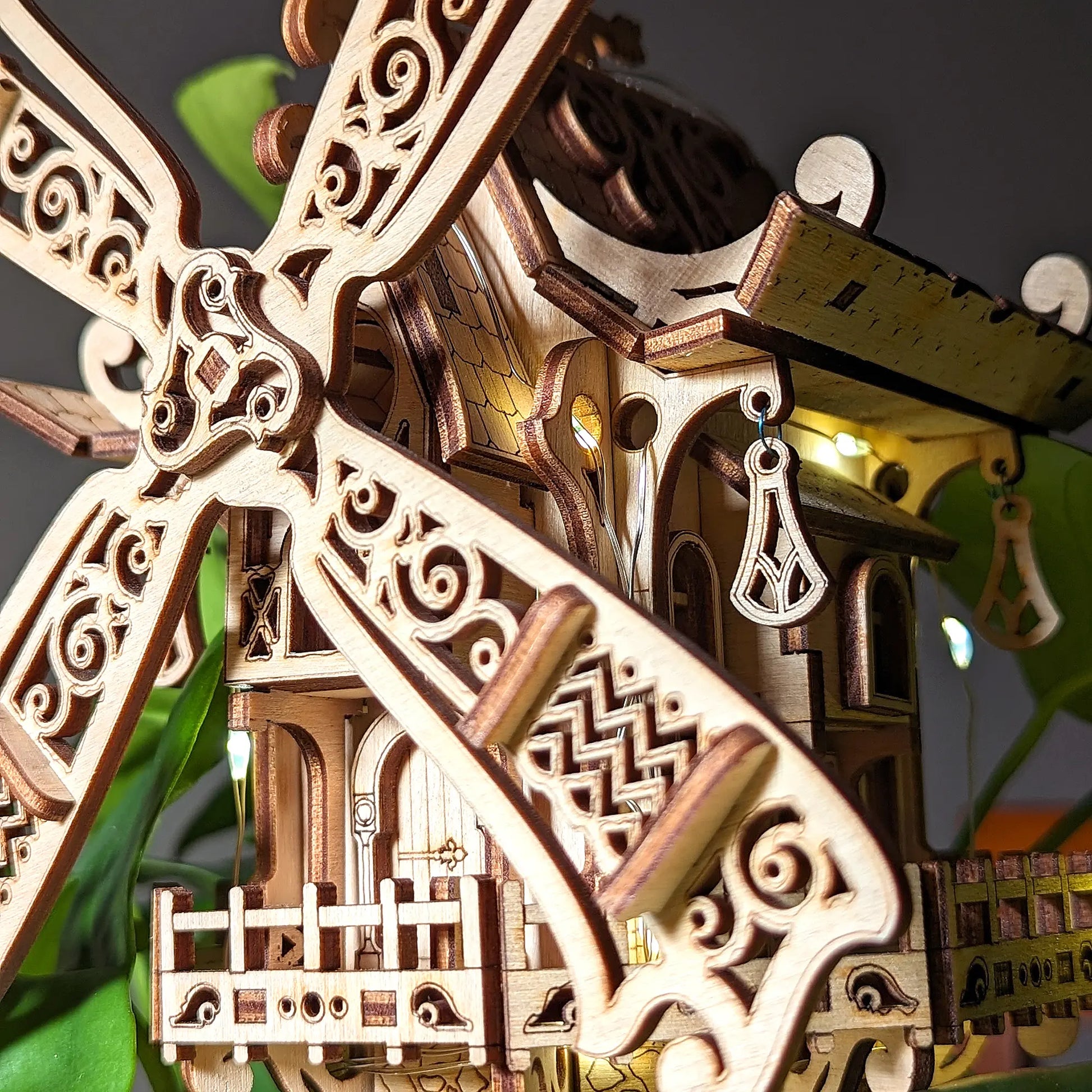 Close-up of a wooden windmill model with intricate details