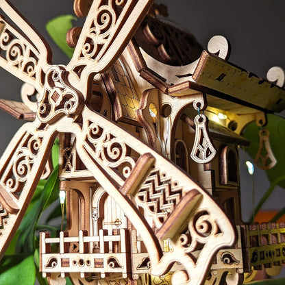 Close-up of a wooden windmill model with intricate details