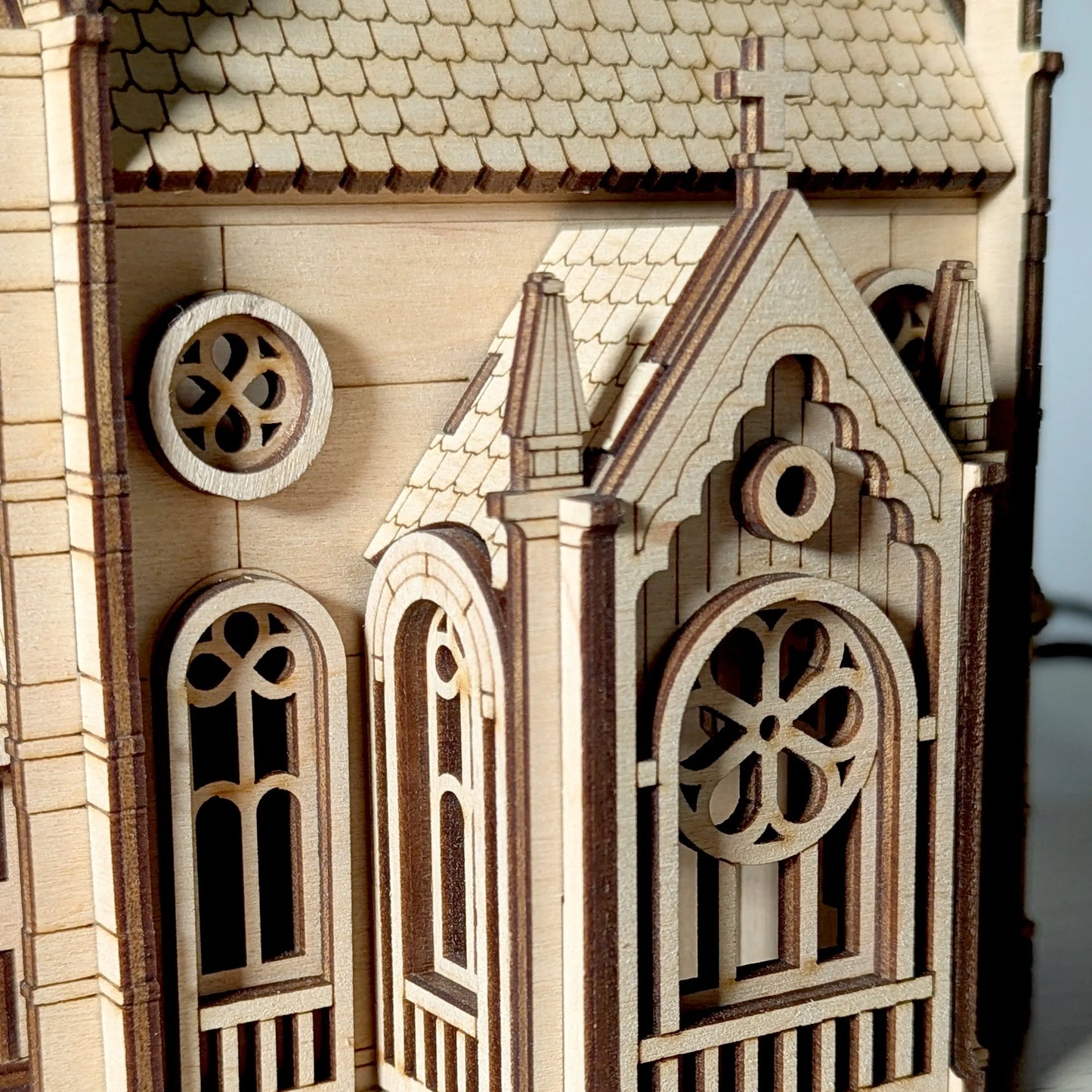 Wooden model of a gothic-style building with detailed architecture.