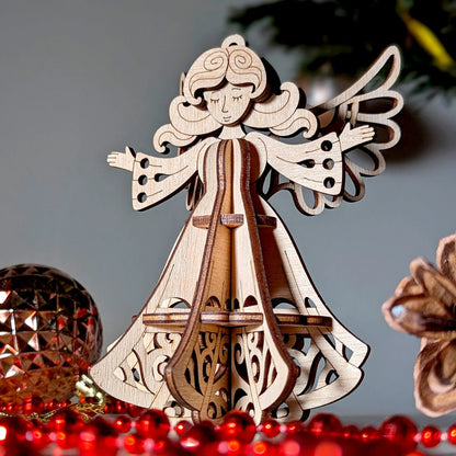 Wooden angel ornament with a lyre on a gray background