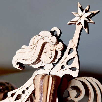 Wooden nativity scene figure with a star on a blurred background